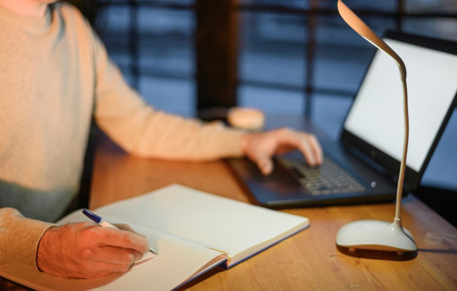 Financial analysis workspace with documents and computer